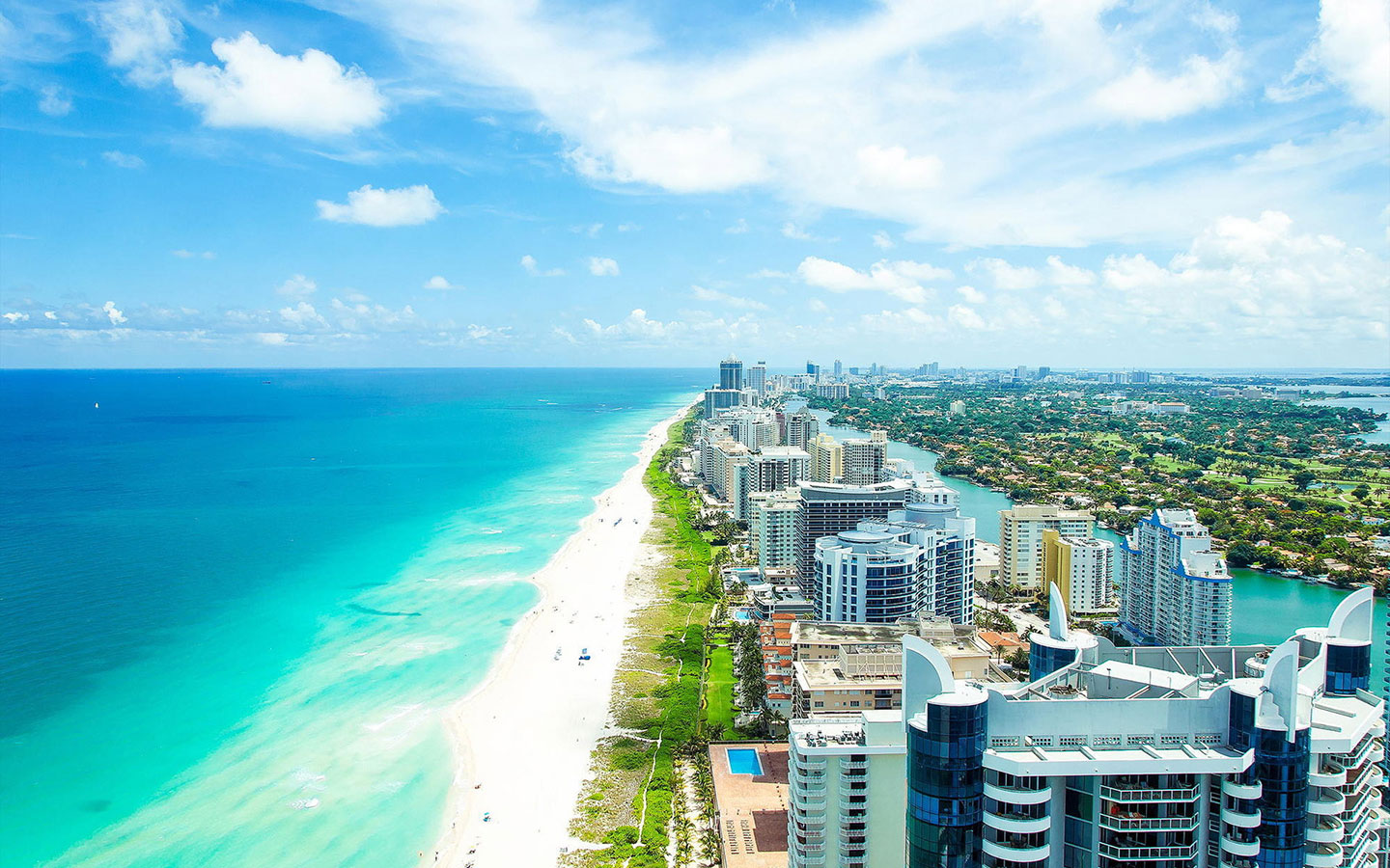 A view of the ocean and beach from above.