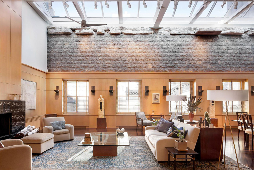 A living room with couches and tables in it