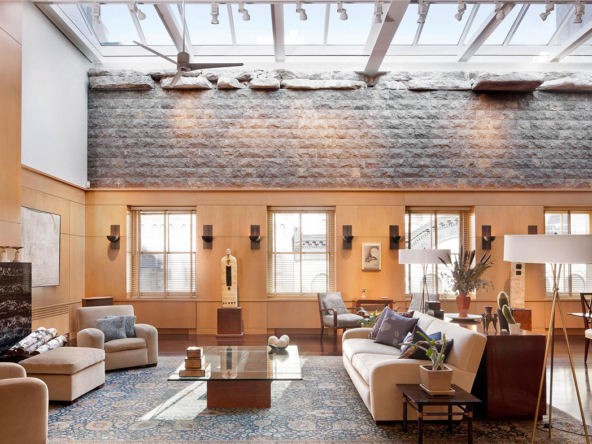 A living room with couches and tables in it